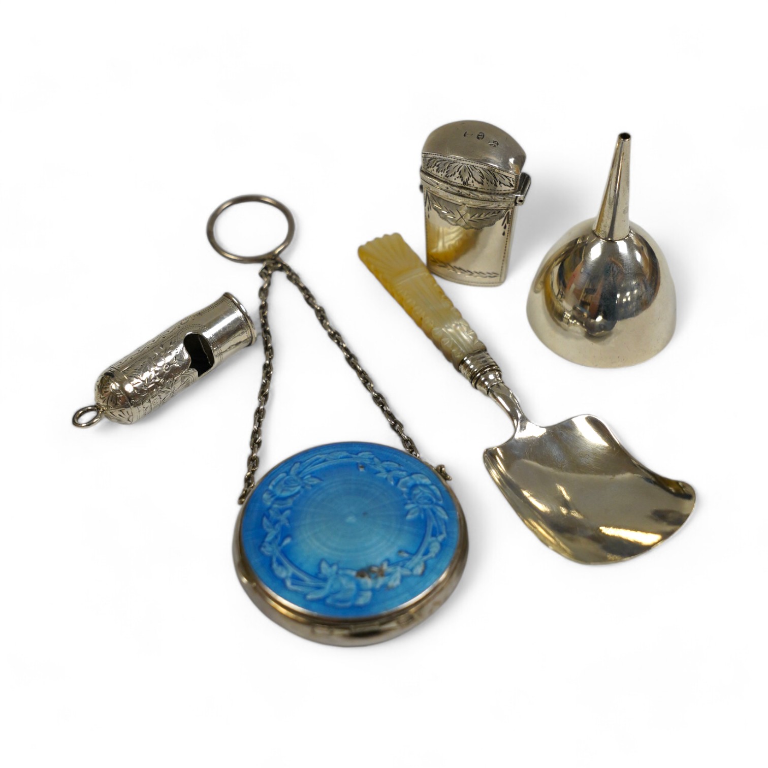 Five assorted small silver items including an early 19th century silver scent bottle case by Samuel Pemberton, containing a small glass flask, a mother of pearl handled caddy spoon, a silver whistle, a small funnel and a